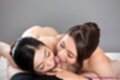 Girls licking hard cock lying on their front naked